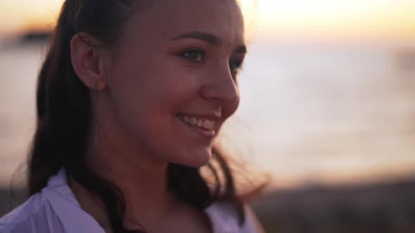 Headshot of Confident Beautiful Smiling Young Woman Looking Away Standing in Darkness Outdoors on alt