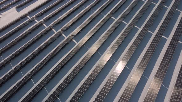 Closeup View From Top on Solar Panels Power Station in Desert at Winter Morning