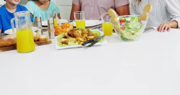 Family having healthy meal together at home alt