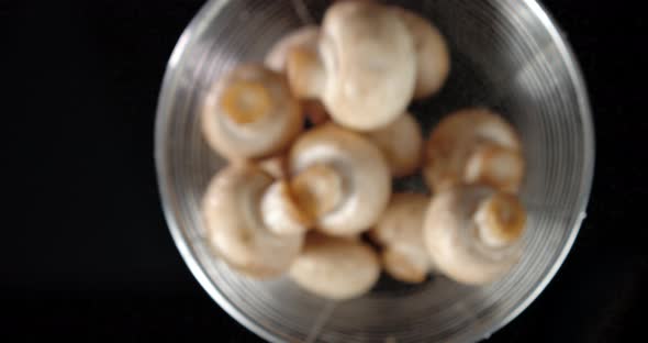 Fresh Mushrooms in a Colander Toss Up.  alt