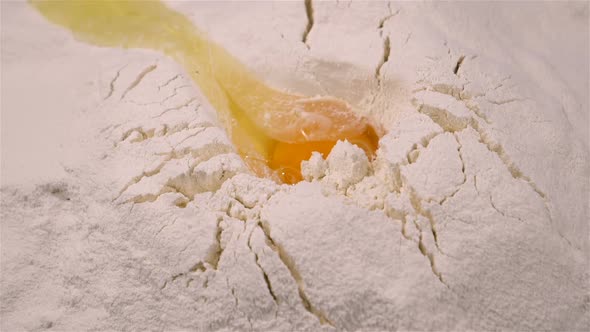 Egg Falling in White Flour