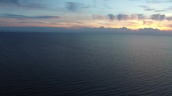 Aerial Flight Over Sea at Sunset
