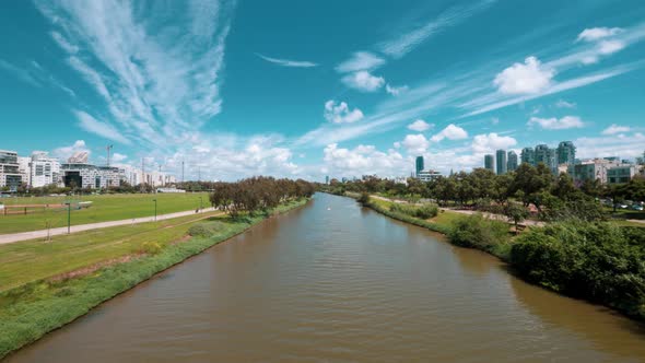 Urban Park by The River with Beautiful Puffy Clouds