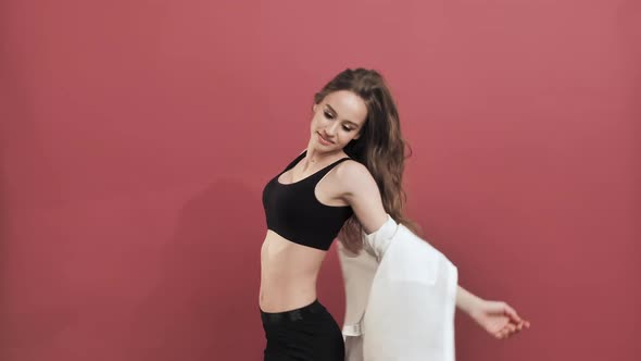 Portrait of Happy Woman Smiling Dancing to Music Rhythmically to Beat Moving Her Hands  alt