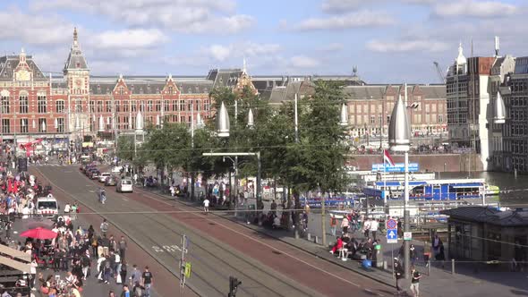 Traffic of Cars, Trams and People Near the Amsterdam Cental Station