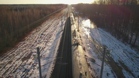 Passenger Train Riding the Railroad in the Morning alt
