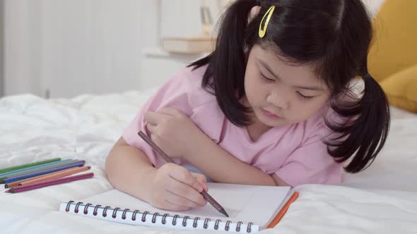 Asia japanese woman child kid relax rest fun happy draw cartoon in sketchbook alt