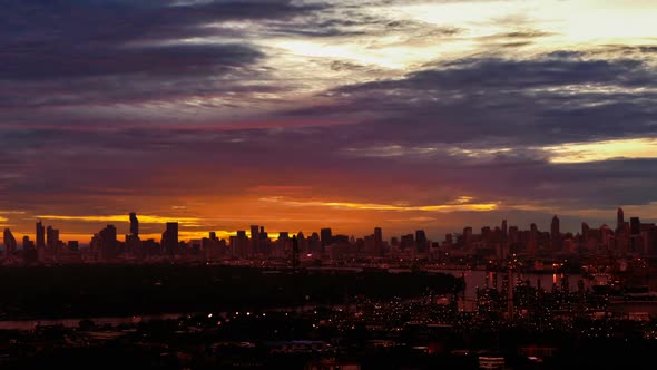 Time lapse petroleum plant cityscape on morning fantastic vivid cloudy sunrise