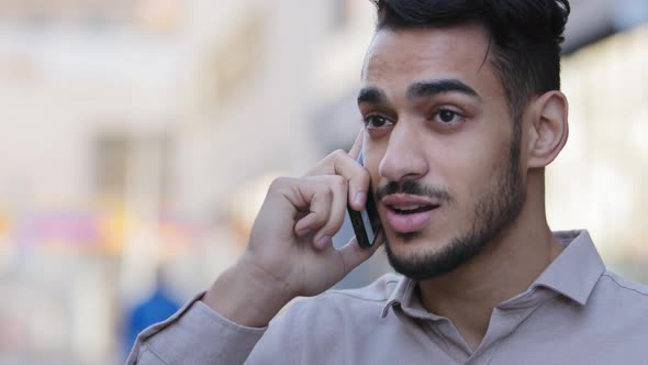 Hispanic Young Adult Businessman Talking Mobile Phone at Street Drinking Hot Coffee Tea alt