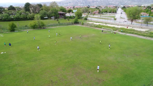 Soccer players training on field Areial View