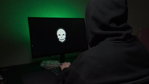 Computer Hacker Typing Code on Keyboard Late Night Working and Bypassing Cyber Security alt