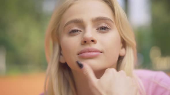 Close-up Face of Blond Young Woman with Grey Eyes Smiling at Camera. Portrait of Charming Beautiful alt
