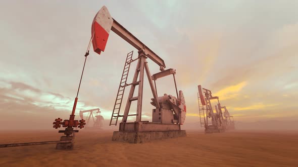 Loopable shot of oil pumps pumping oil on a field with god rays. Oil industry 4K alt