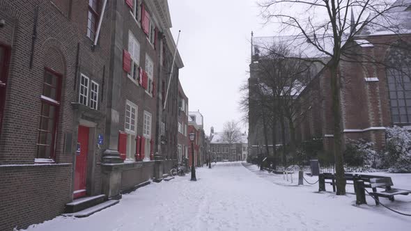 Point-of-view (POV) shot walking through snowy city streets, Leiden Netherlands alt