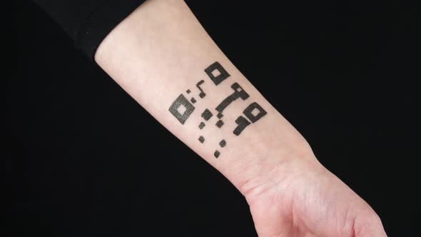 A Woman Reads the Barcode Using a Smartphone Camera. Abstract Tattoo on the Body, Hand with a QR alt