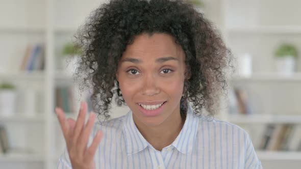 Beautiful African Woman Doing Video Chat alt