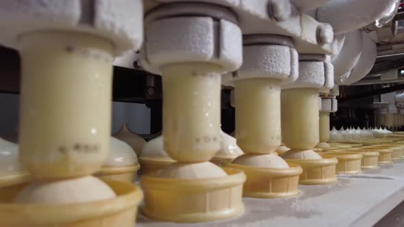 Ice Cream Production Line. Filling of Wafer Cups with Ice Cream. Ice Cream Factory alt
