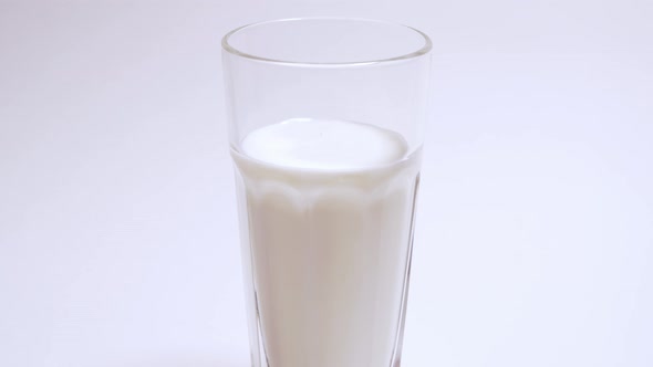 A Hearty and Healthy Breakfast Consisting of Calcium and Vitamins. Gradual Filling of a Glass with