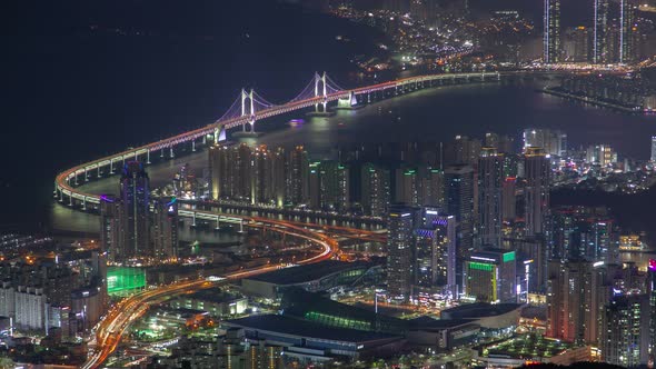 Timelapse Busan Highway with Bridge Over Bay at Night alt
