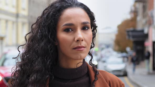 Pensive Serious Young Beautiful Girl Woman Brunette Female Model Tourist Stands on Street in City alt