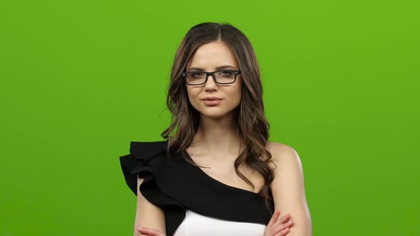 Brunette with Glasses Starts Flirting, She Smiles Sweetly. Green Screen alt