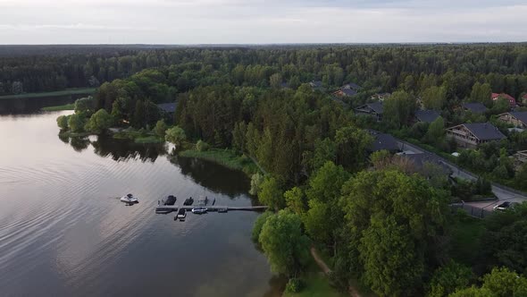 Drone flying over lake with boat