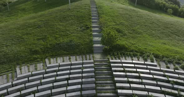 Aerial shot of Didgori Valley memorial monuments, amphitheatre and landscape. alt