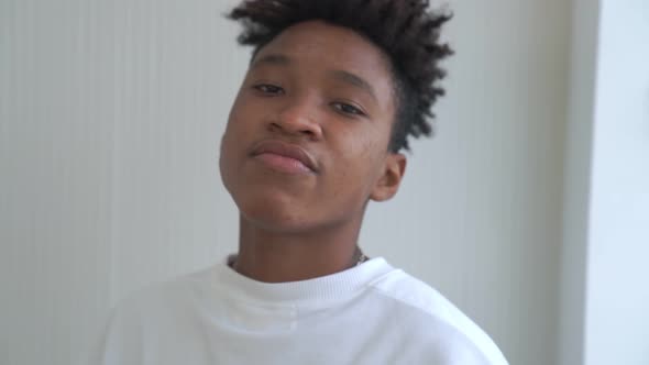 Young African Man Take Off Face Mask Removing From Face alt