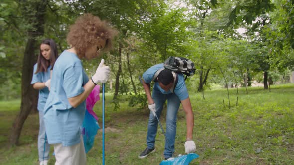 Mixed Race Activists Giving High Five Rejoicing Finished Work Outdoors alt
