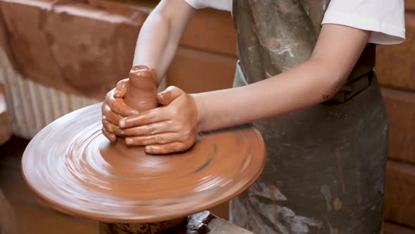 Wheel Potter Hand Clay Shaping or Sculpting alt