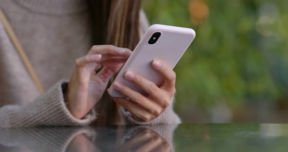 Woman use of mobile phone alt