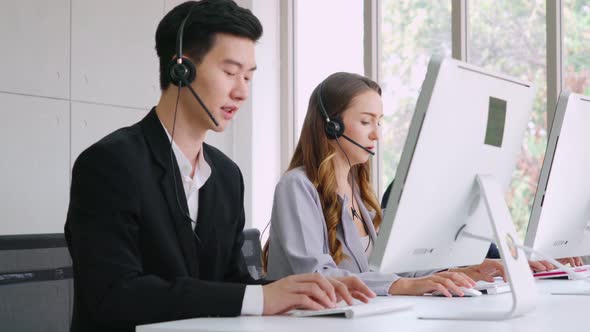 Business People Wearing Headset Working in Office alt