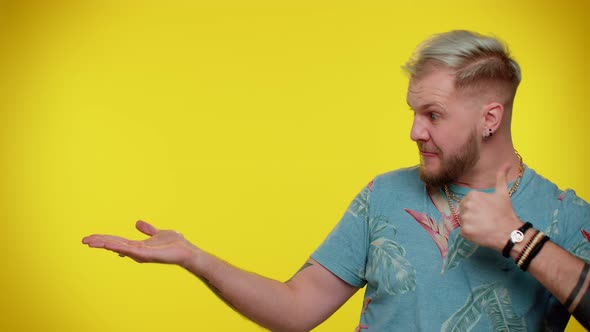 Man Pointing Empty Place Advertising Area for Commercial Text Copy Space for Goods Promotion alt