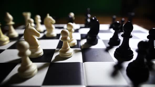 White and black pieces on a chess board