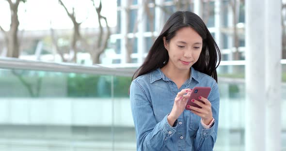 Woman use of smart phone at outdoor alt