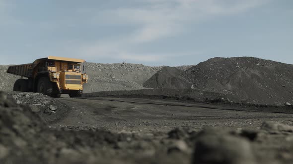Empty Dump Truck Moves Quickly to Load Coal