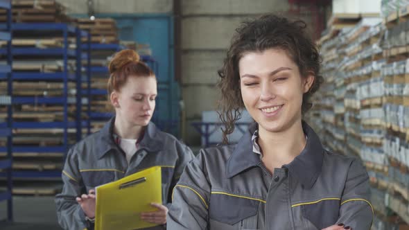 Beautiful Cheerful Female Factory Worker Smiling To the Camera alt