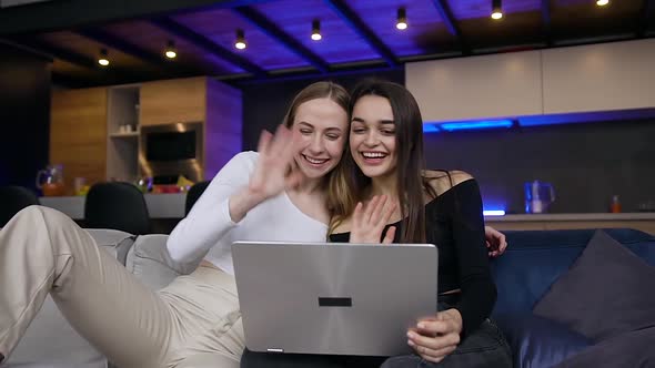 Women which Having Video Call on Computer with Joint Friends alt