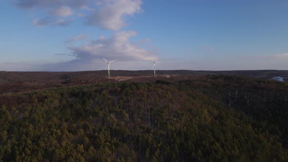 Aerial Drone View Wind Power Turbine on the Horizon Green Energy Concept