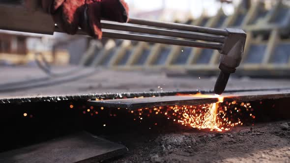 gas cutting of metal, sparks fly alt