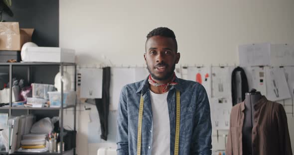 Portrait of African American Man Designer Smiling Looking at Camera in Workshop alt