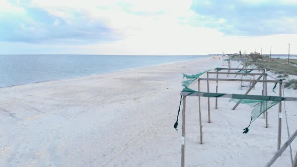 Beautiful sandy beach with empty resort. alt
