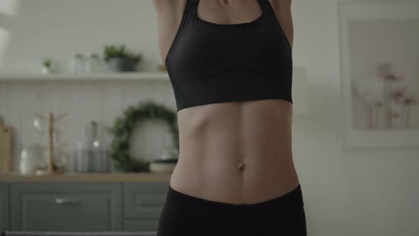 Woman Doing Dumbbell Shoulder Press alt