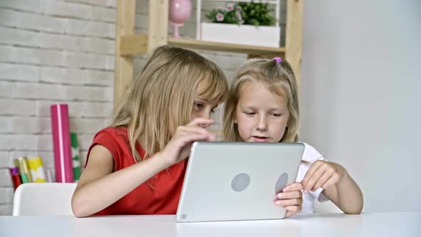 Little Girls with Tablet Chatting alt