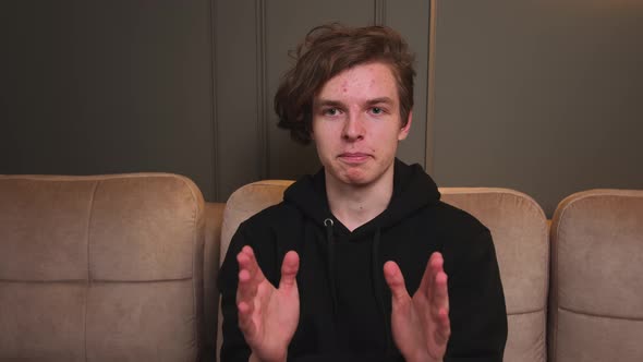 Portrait of Smiling Man Looking at Camera at Home alt