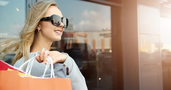 Happy Woman with Shopping Bags