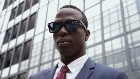 Success, Challenge, Leadership- Black Business Man with Sunglasses in The City alt