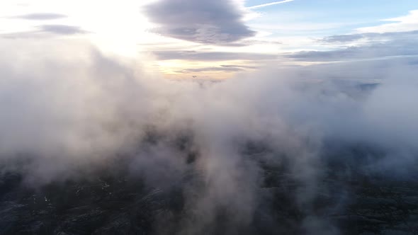 Aerial of Mountain Top Surrounded by Clouds 03 alt