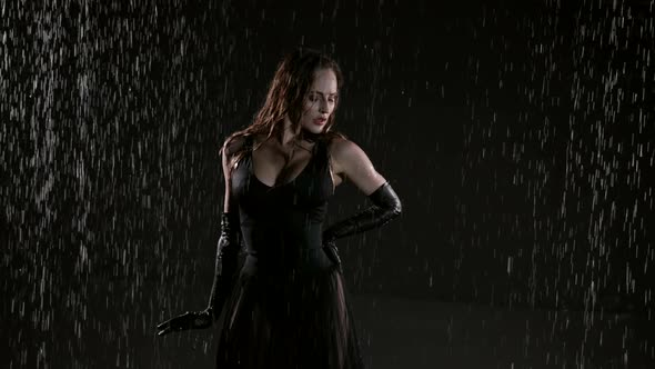 Sexy Lady in Black Dress and Gloves is Posing Sexually Under Rain at Night Mysterious and Enigmatic alt