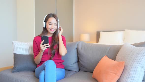 Woman use smart phone for listen music alt